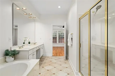 a white toilet sitting next to a shower