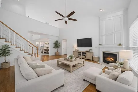 a living room with furniture fireplace and a flat screen tv