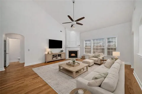 a living room with furniture fireplace and a flat screen tv