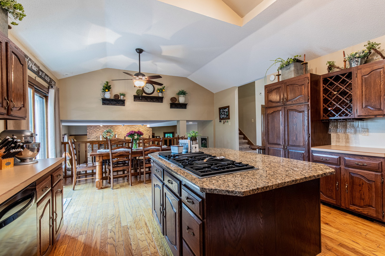 1000 Timber Ridge Road Princeton, IL 61356 - Photo 21 of 55 a kitchen with a kitchen island a stove a table and chairs in it