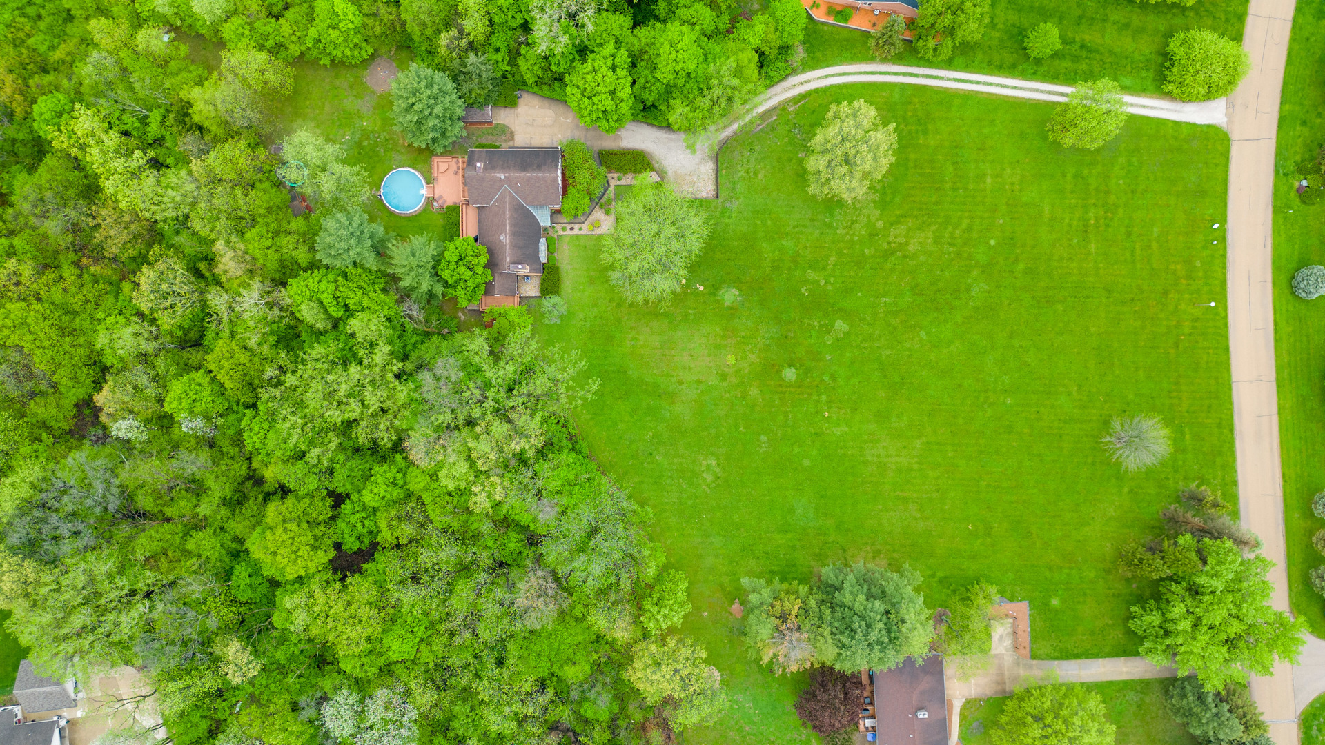 1000 Timber Ridge Road Princeton, IL 61356 - Photo 4 of 55 a backyard of a house with lots of green space and trees