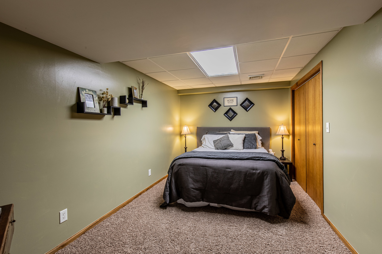 1000 Timber Ridge Road Princeton, IL 61356 - Photo 41 of 55 a bedroom with a bed and a painting on the wall