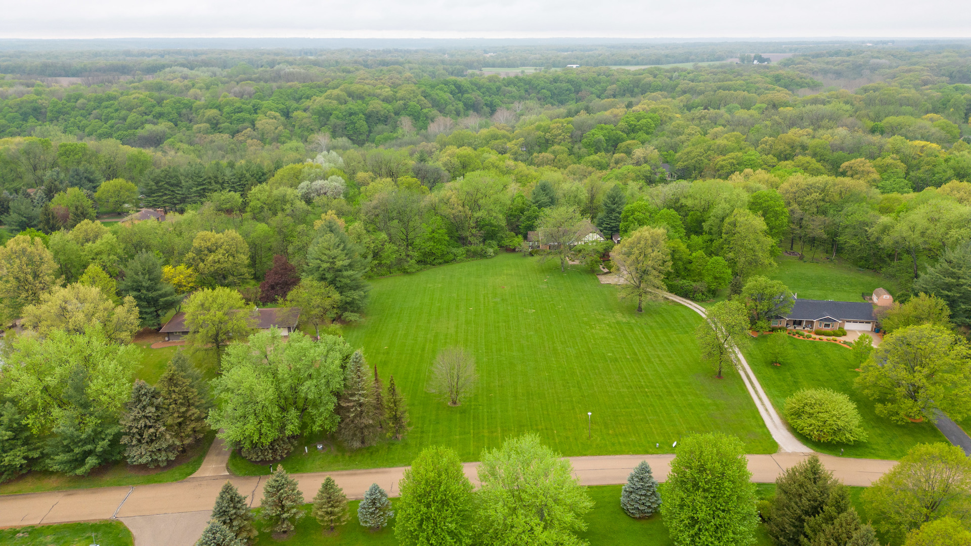 1000 Timber Ridge Road Princeton, IL 61356 - Photo 53 of 55 a view of a green yard with large trees
