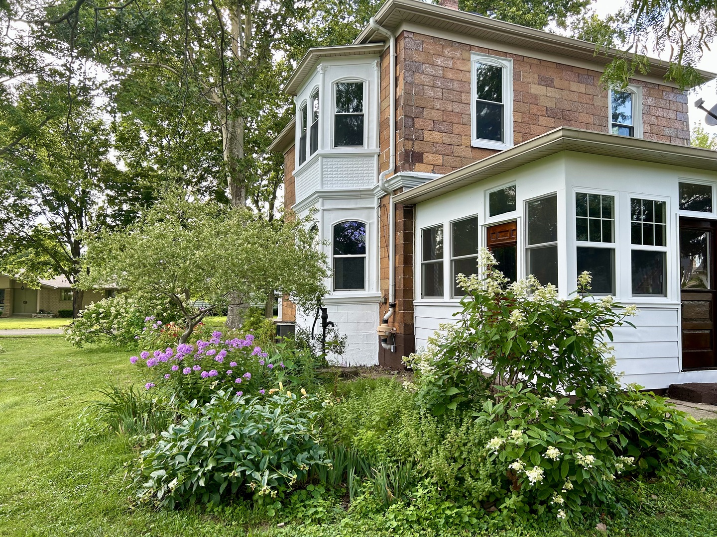 109 South Bureau Avenue Ladd, IL 61329 - Photo 22 of 23 a front view of a house with plants