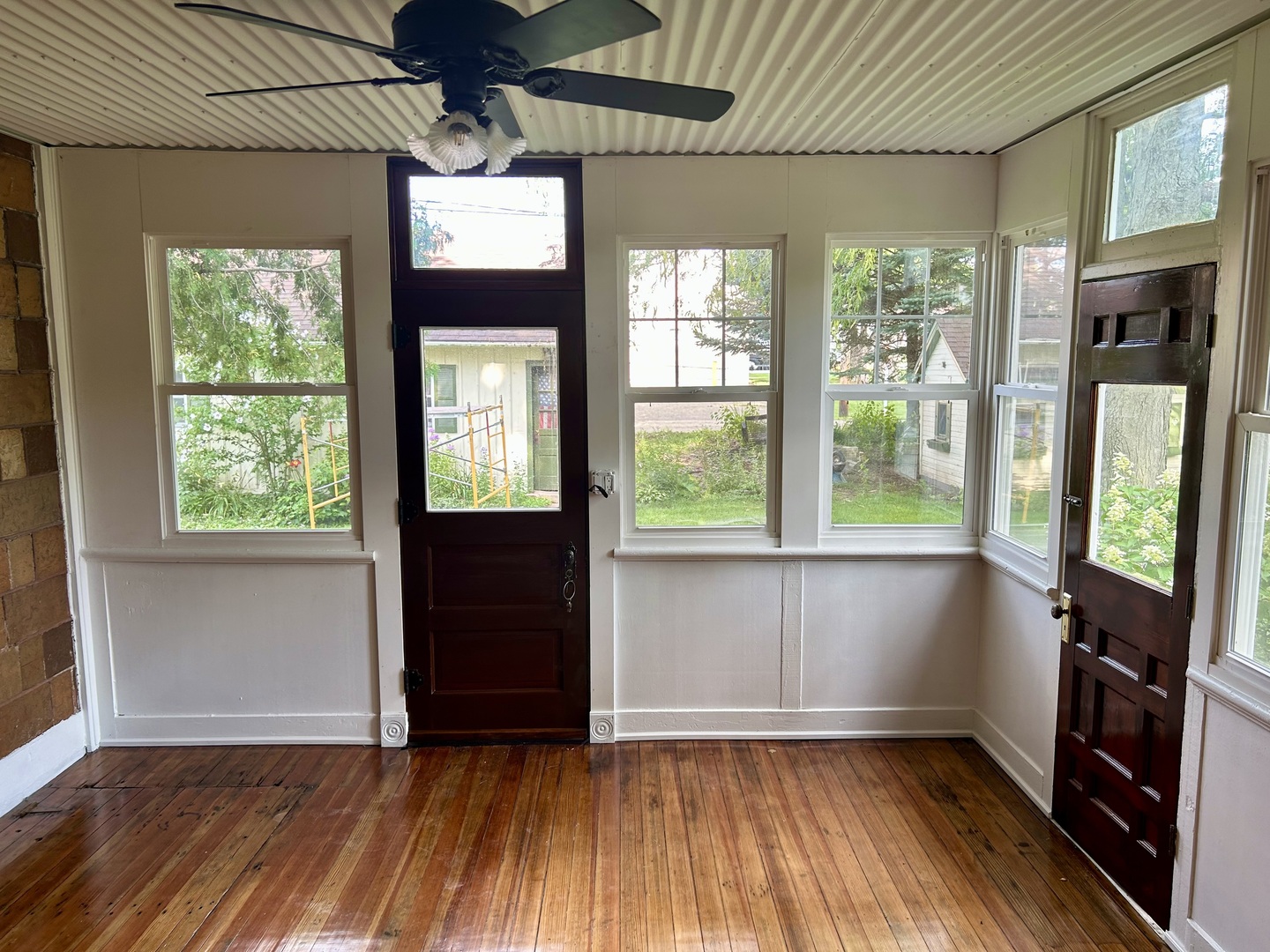109 South Bureau Avenue Ladd, IL 61329 - Photo 10 of 23 an empty room with wooden floor and windows