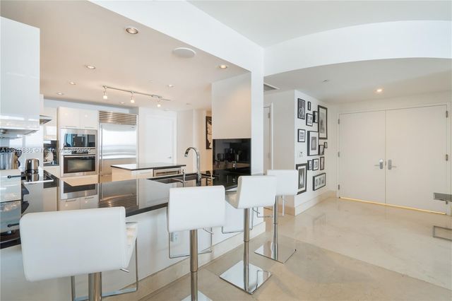 a spacious bathroom with a bathtub and a sink