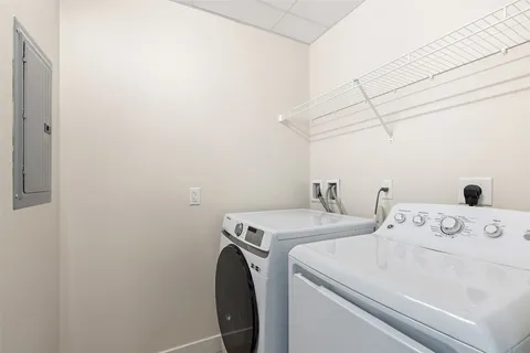 a bathroom with a sink toilet a mirror and shower