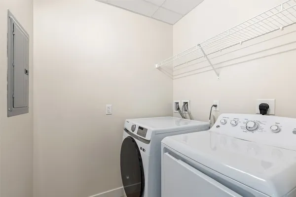 a bathroom with a sink toilet a mirror and shower