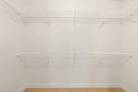 a bathroom with a sink a mirror and a shower