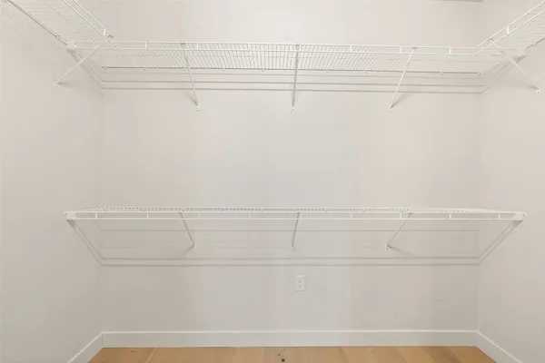 a bathroom with a sink a mirror and a shower