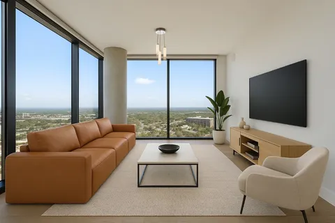 a living room with furniture a large window and a flat screen tv