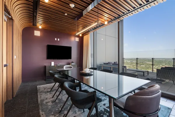 a view of living room with furniture and floor to ceiling window