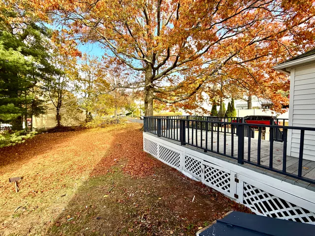 a balcony with wooden floor