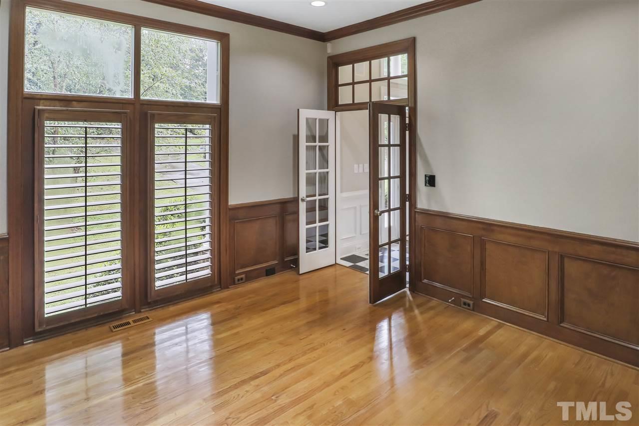 512 Pendleton Lake Road Raleigh, NC 27614 - Photo 11 of 30 an empty room with wooden floor and windows
