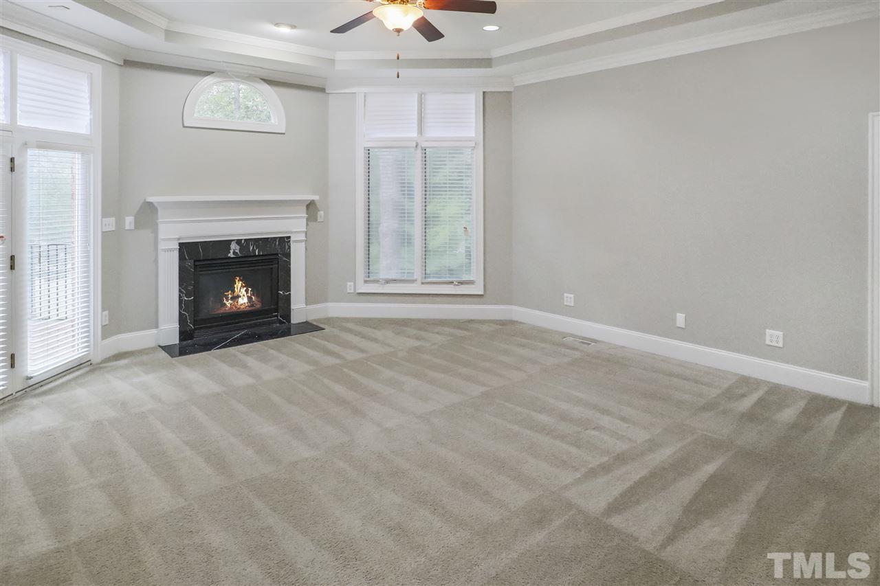 512 Pendleton Lake Road Raleigh, NC 27614 - Photo 12 of 30 a view of an empty room with a window and fireplace