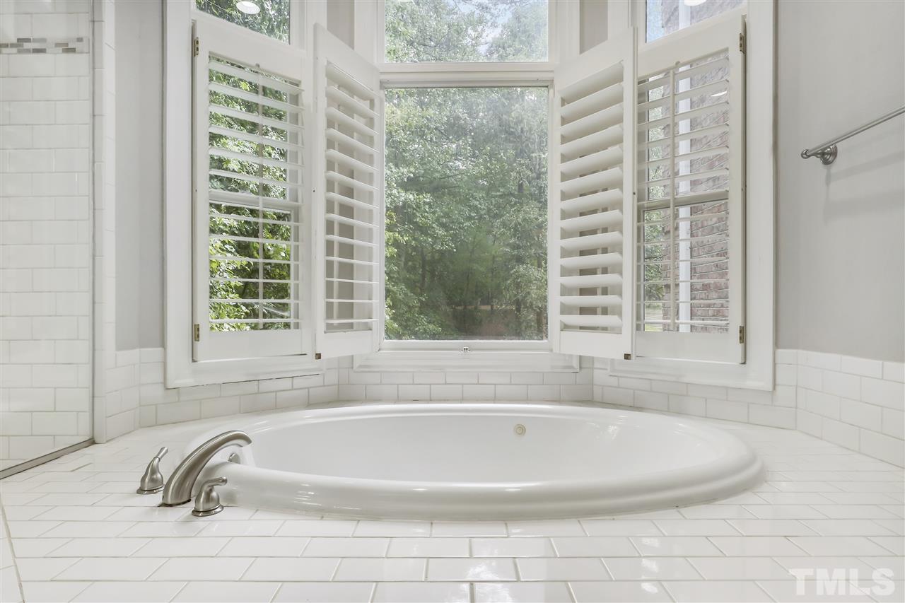 512 Pendleton Lake Road Raleigh, NC 27614 - Photo 14 of 30 a white bath tub sitting next to a window