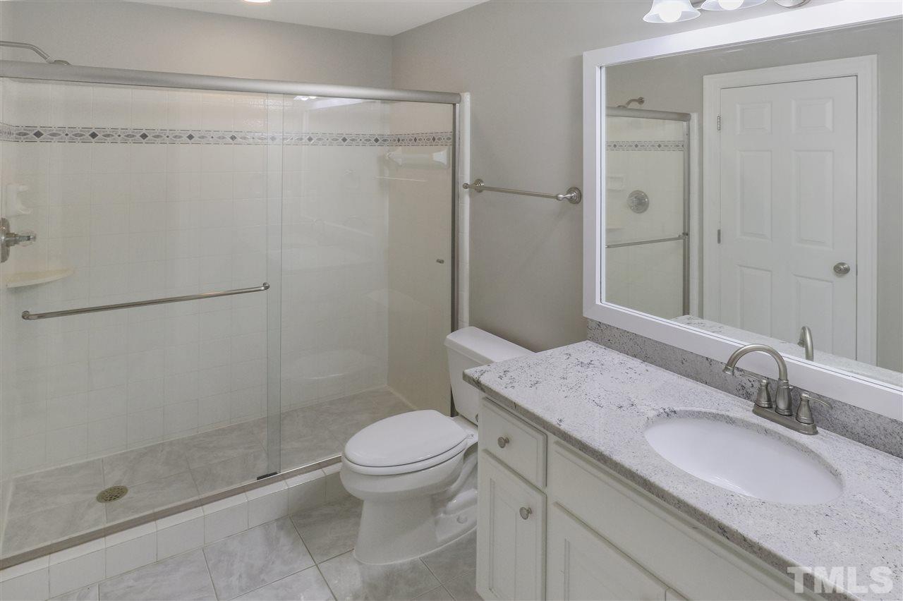 512 Pendleton Lake Road Raleigh, NC 27614 - Photo 25 of 30 a bathroom with a granite countertop sink toilet and shower