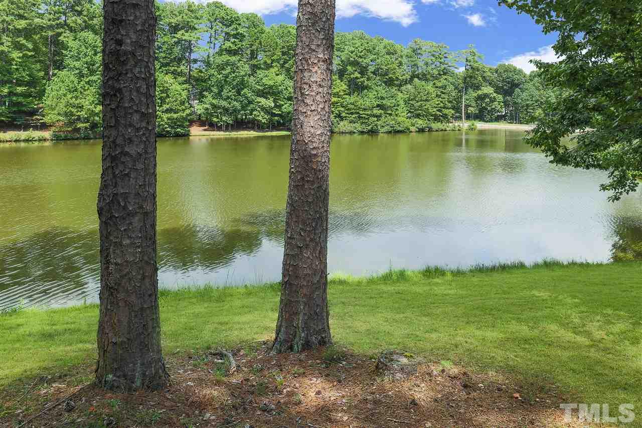 512 Pendleton Lake Road Raleigh, NC 27614 - Photo 29 of 30 a view of a lake with a yard