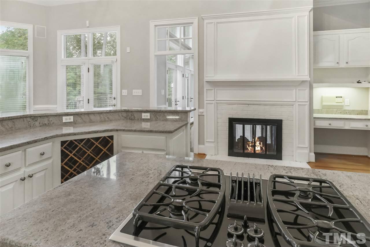 512 Pendleton Lake Road Raleigh, NC 27614 - Photo 6 of 30 a kitchen with stainless steel appliances a stove a sink and a microwave