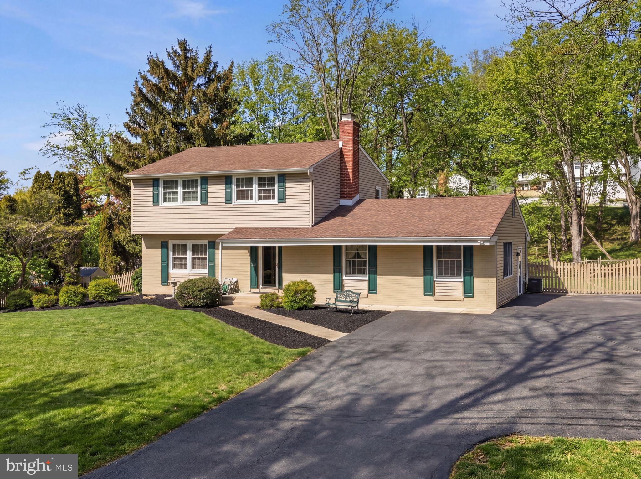 1848 Brackenville Road Hockessin, DE 19707 - Photo 1 of 37 a front view of a house with a garden