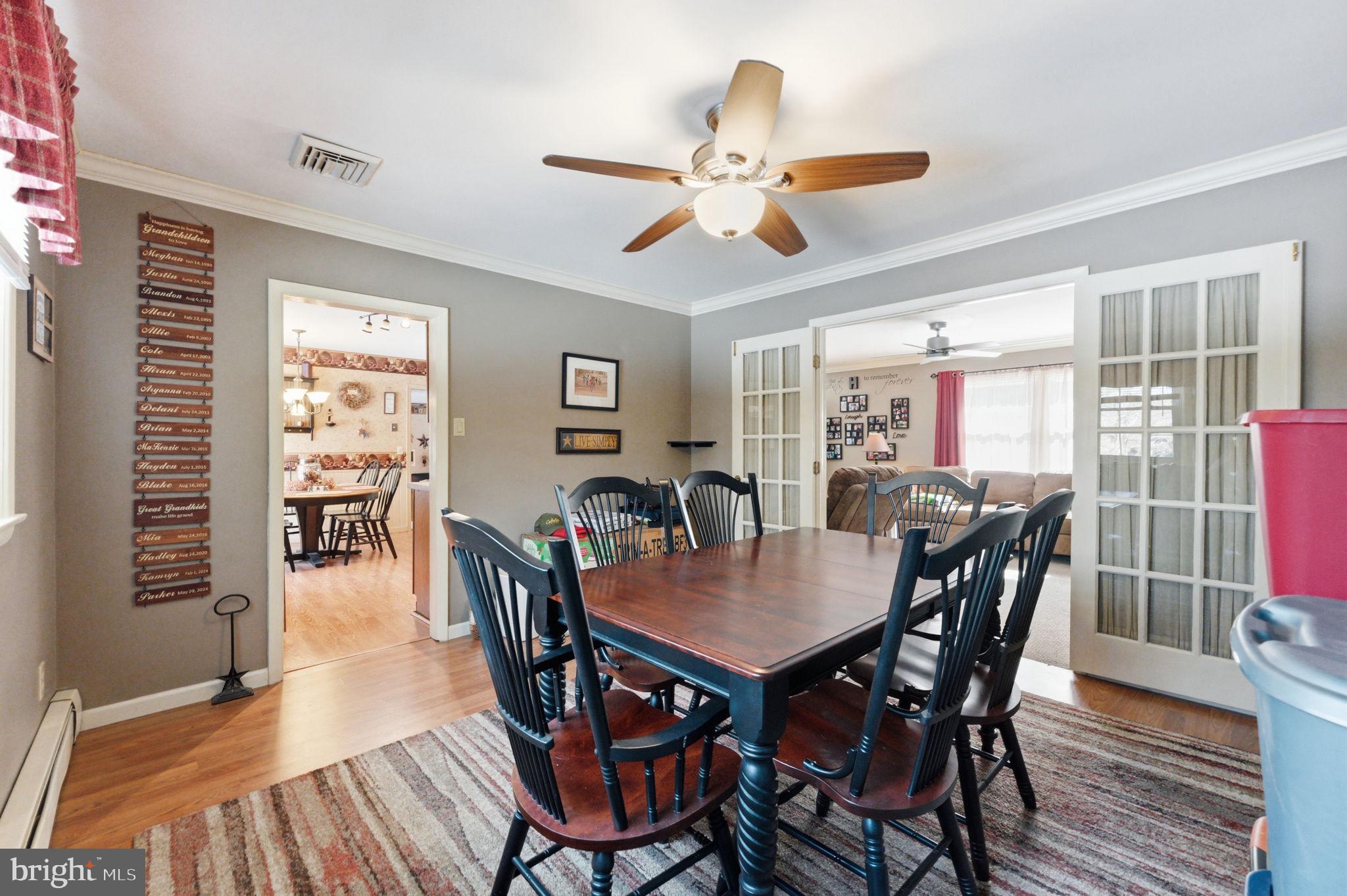 1848 Brackenville Road Hockessin, DE 19707 - Photo 11 of 37 a view of a dining room with furniture window and wooden floor