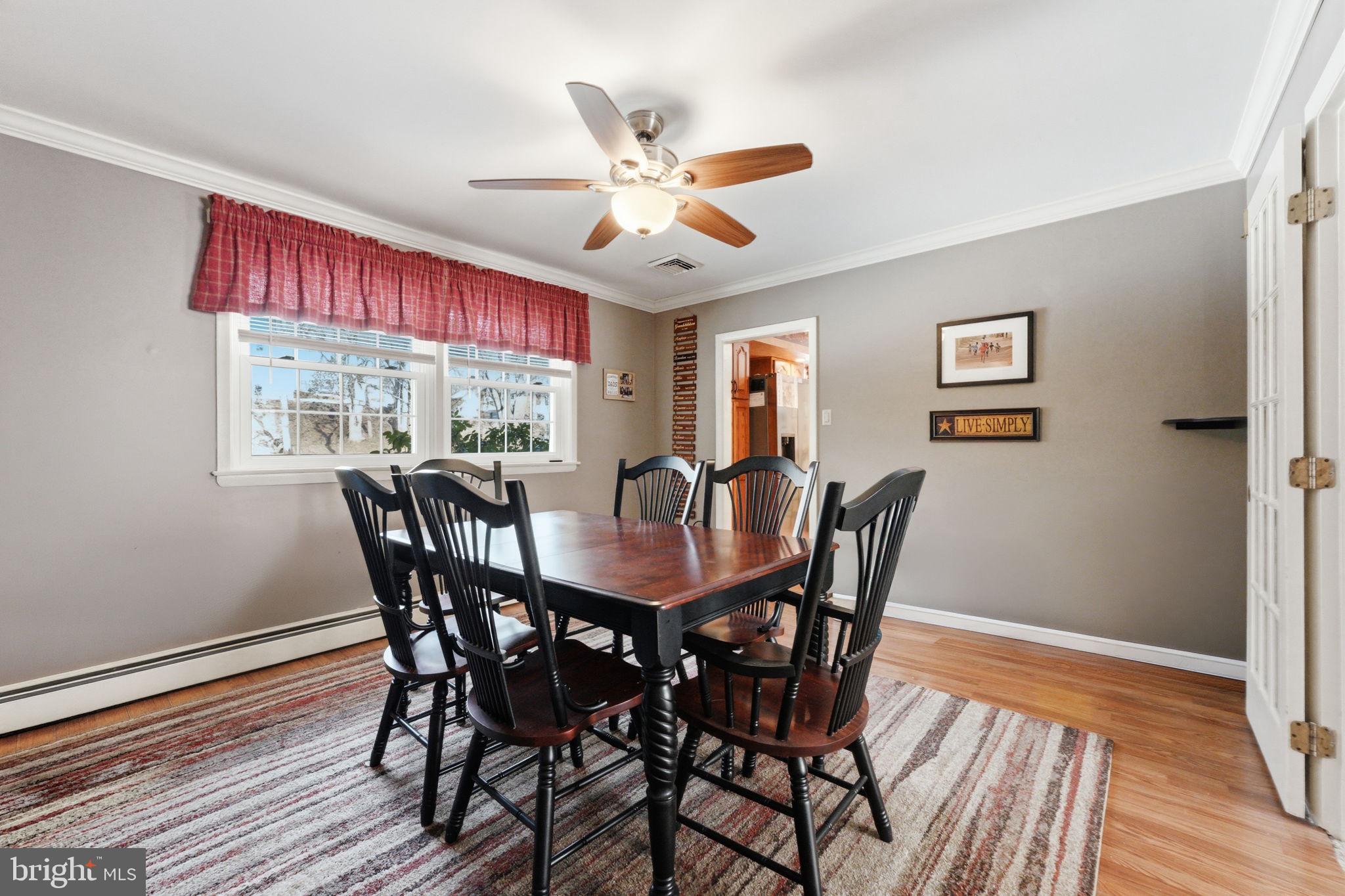1848 Brackenville Road Hockessin, DE 19707 - Photo 12 of 37 a view of a dining room with furniture window and wooden floor