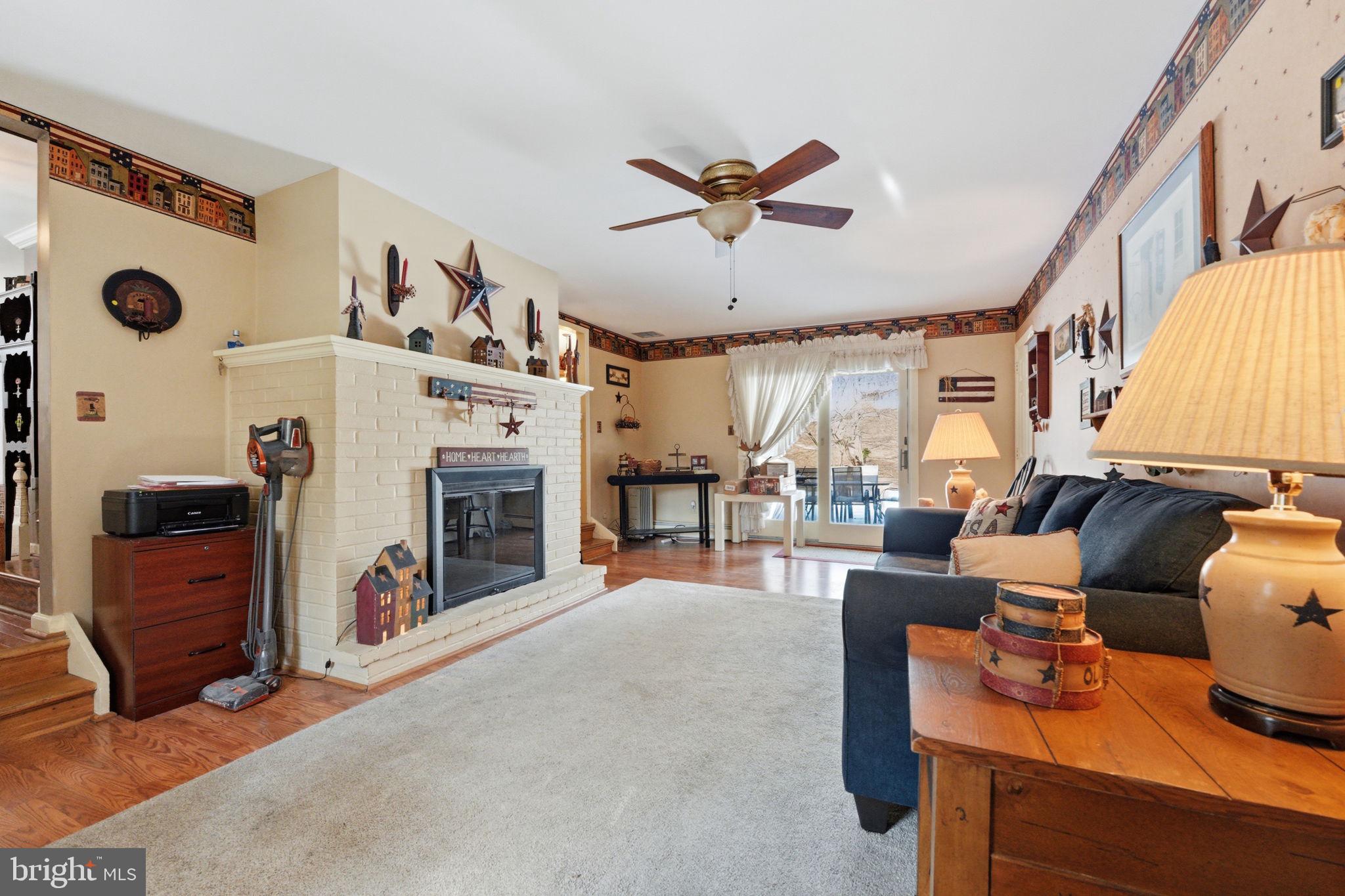 1848 Brackenville Road Hockessin, DE 19707 - Photo 13 of 37 a living room with furniture and a fireplace