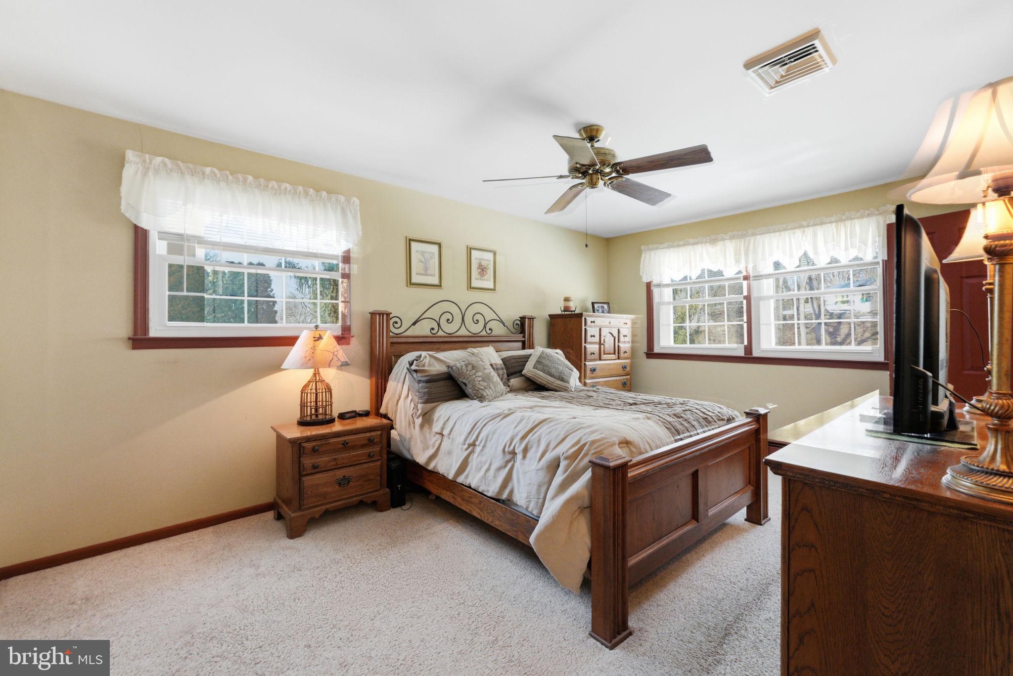 1848 Brackenville Road Hockessin, DE 19707 - Photo 17 of 37 a bedroom with a bed couch tv and a window