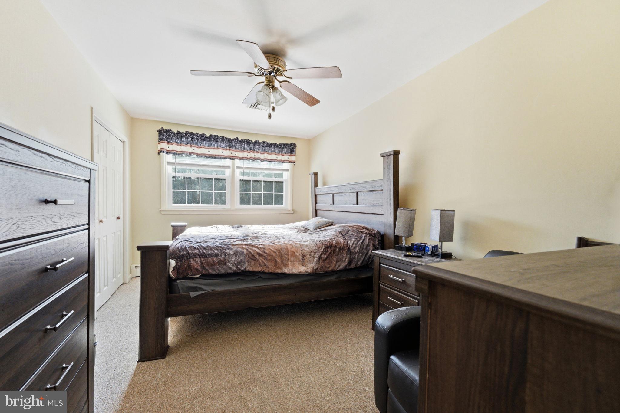 1848 Brackenville Road Hockessin, DE 19707 - Photo 21 of 37 a bedroom with a bed and a chandelier