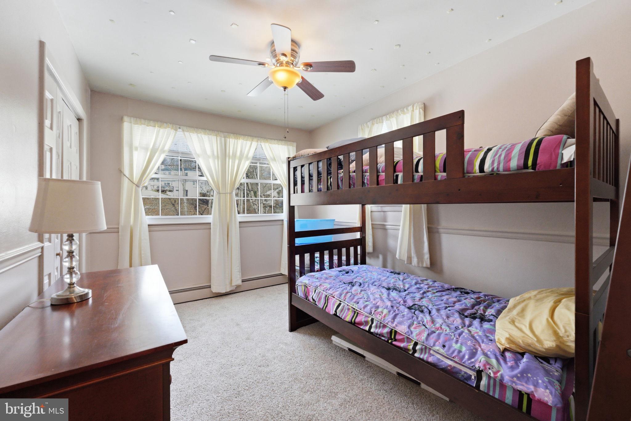 1848 Brackenville Road Hockessin, DE 19707 - Photo 22 of 37 a bedroom with a bed bookshelf and a window
