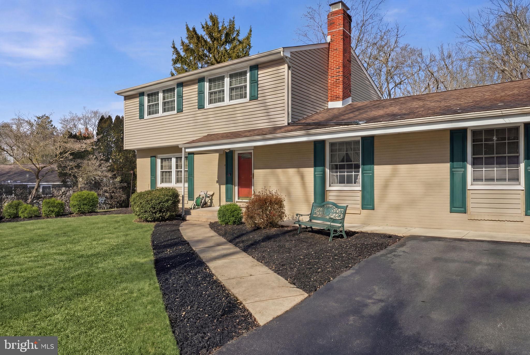1848 Brackenville Road Hockessin, DE 19707 - Photo 3 of 37 a front view of a house with a yard and potted plants