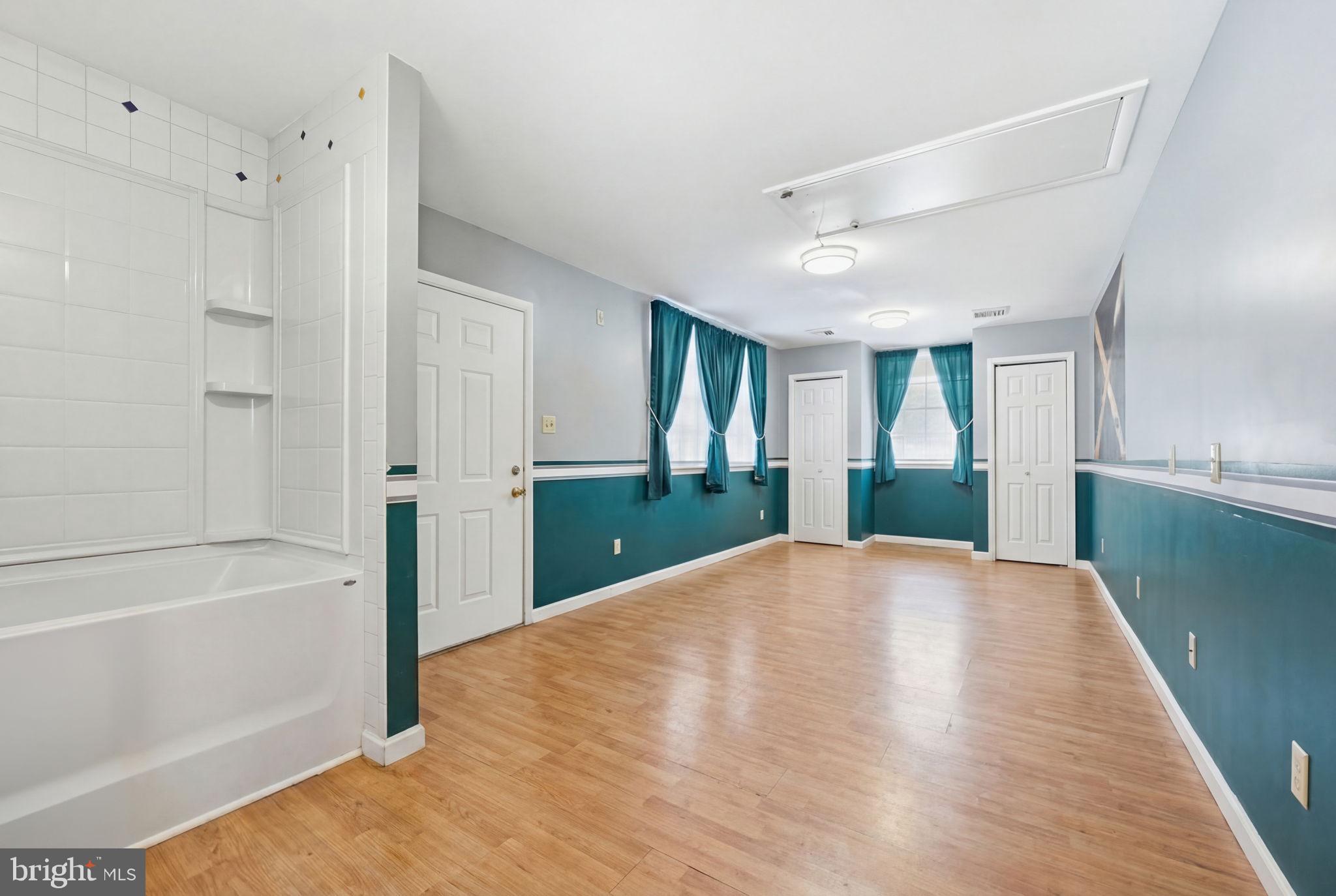 1848 Brackenville Road Hockessin, DE 19707 - Photo 31 of 37 a view of an empty room with window and wooden floor