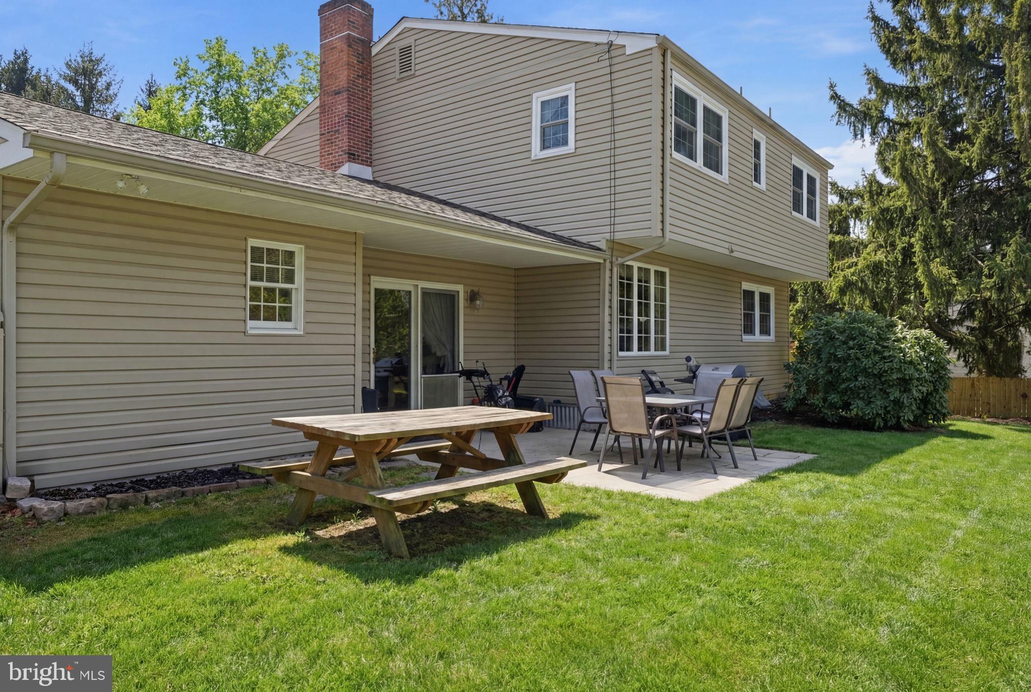 1848 Brackenville Road Hockessin, DE 19707 - Photo 34 of 37 a backyard of a house with table and chairs