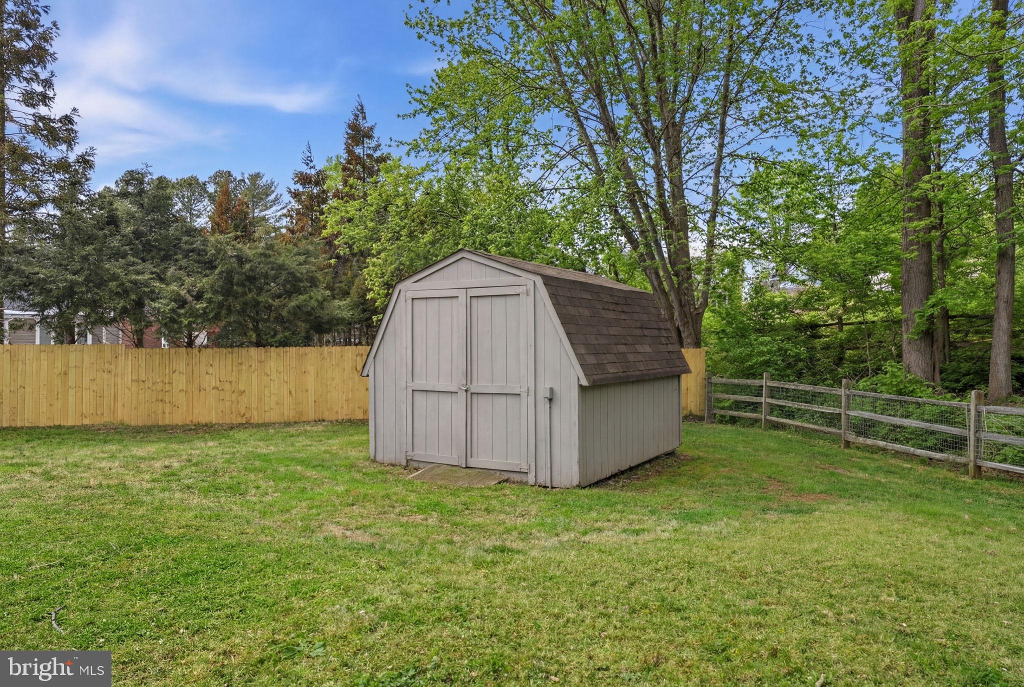 1848 Brackenville Road Hockessin, DE 19707 - Photo 37 of 37 a backyard of a house with lots of green space