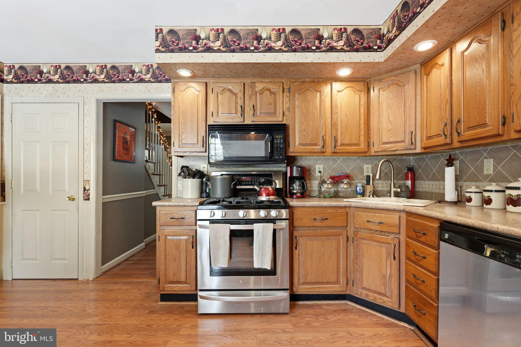 1848 Brackenville Road Hockessin, DE 19707 - Photo 9 of 37 a kitchen with a stove and a refrigerator