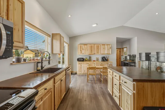 a view of kitchen and dining room with a large window