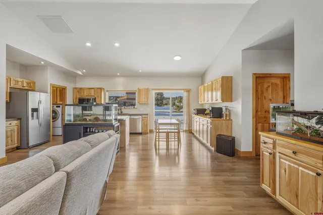 a kitchen with stainless steel appliances a sink and cabinets
