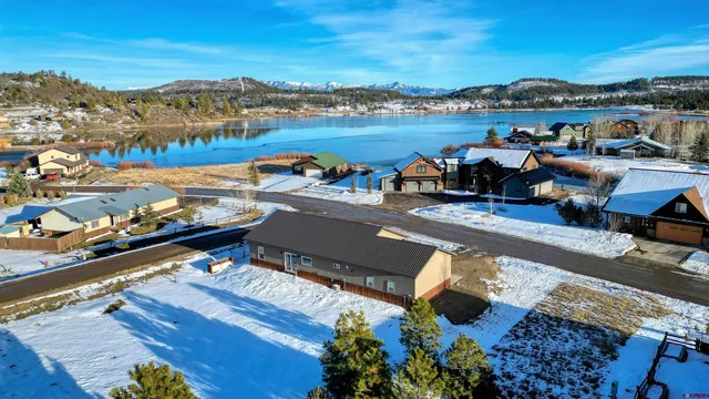 an outdoor space with lounge chairs
