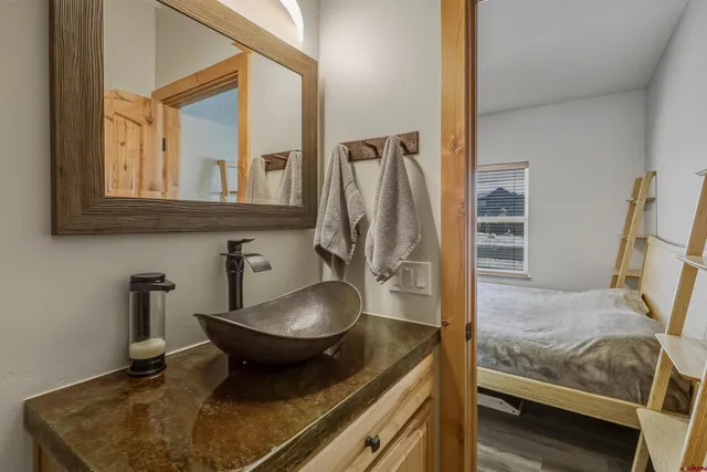 a bathroom with a shower curtain and a toilet