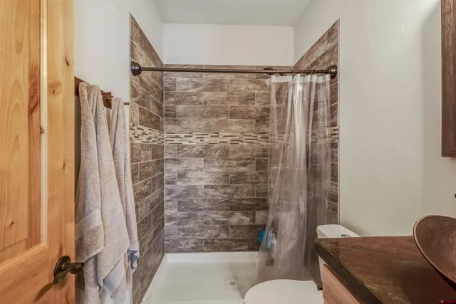 a view of living room with furniture and entryway