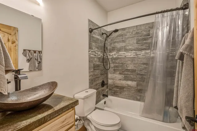 a bed room with a bed and a chair