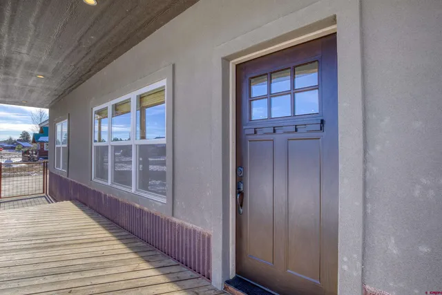 a view of a balcony with wooden floor