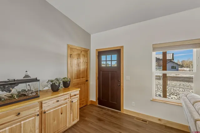 a kitchen with stainless steel appliances a refrigerator and cabinets