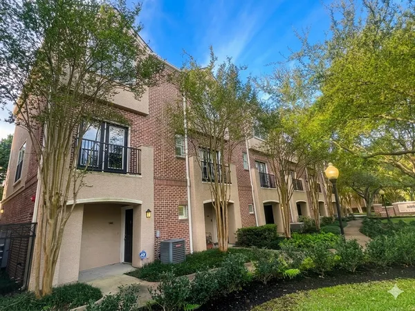 a view of a building with a garden