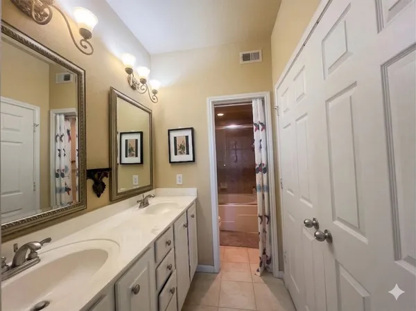 a white bath tub sitting next to a white toilet