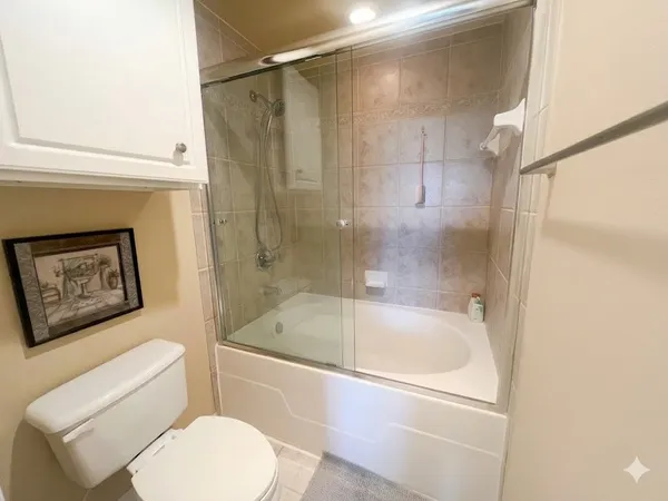 a bathroom with a shower and a sink