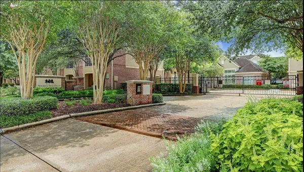 a view of a house with swimming pool and sitting area