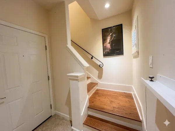 a view of a hallway with staircase