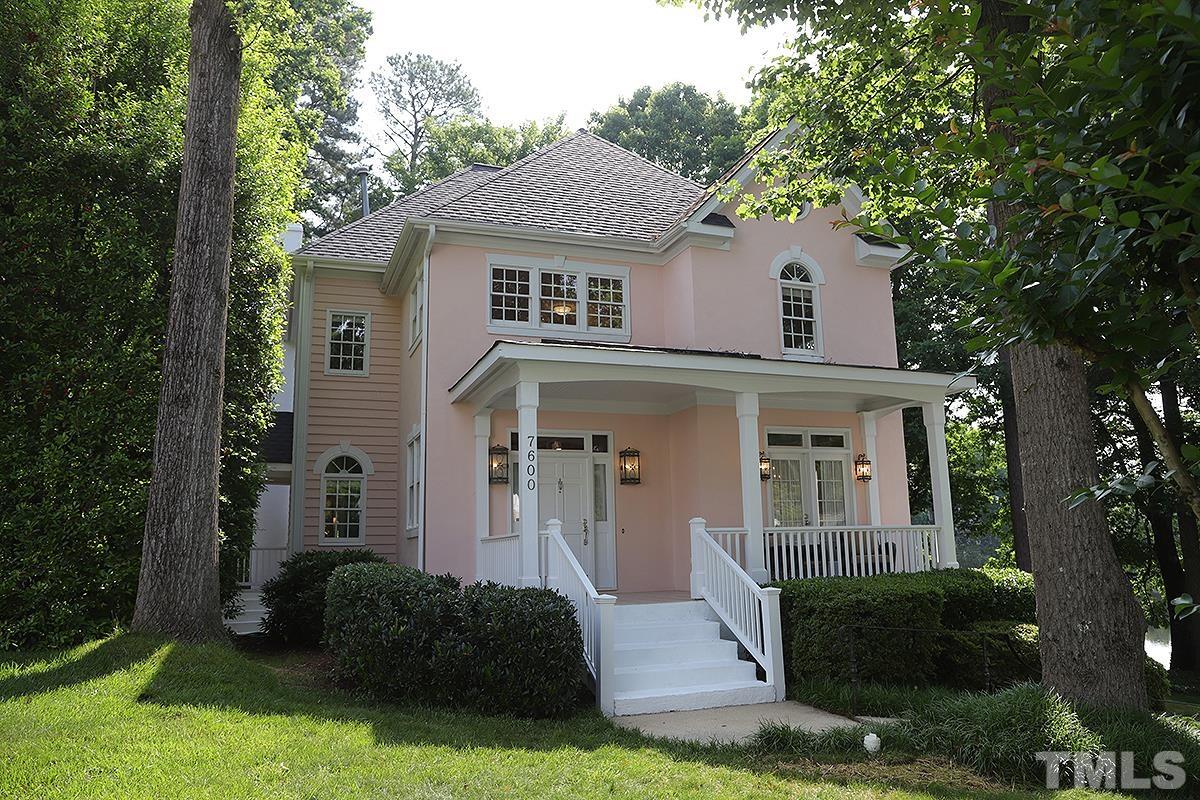7600 Pinewild Court Raleigh, NC 27615 - Photo 1 of 52 a front view of a house with a yard