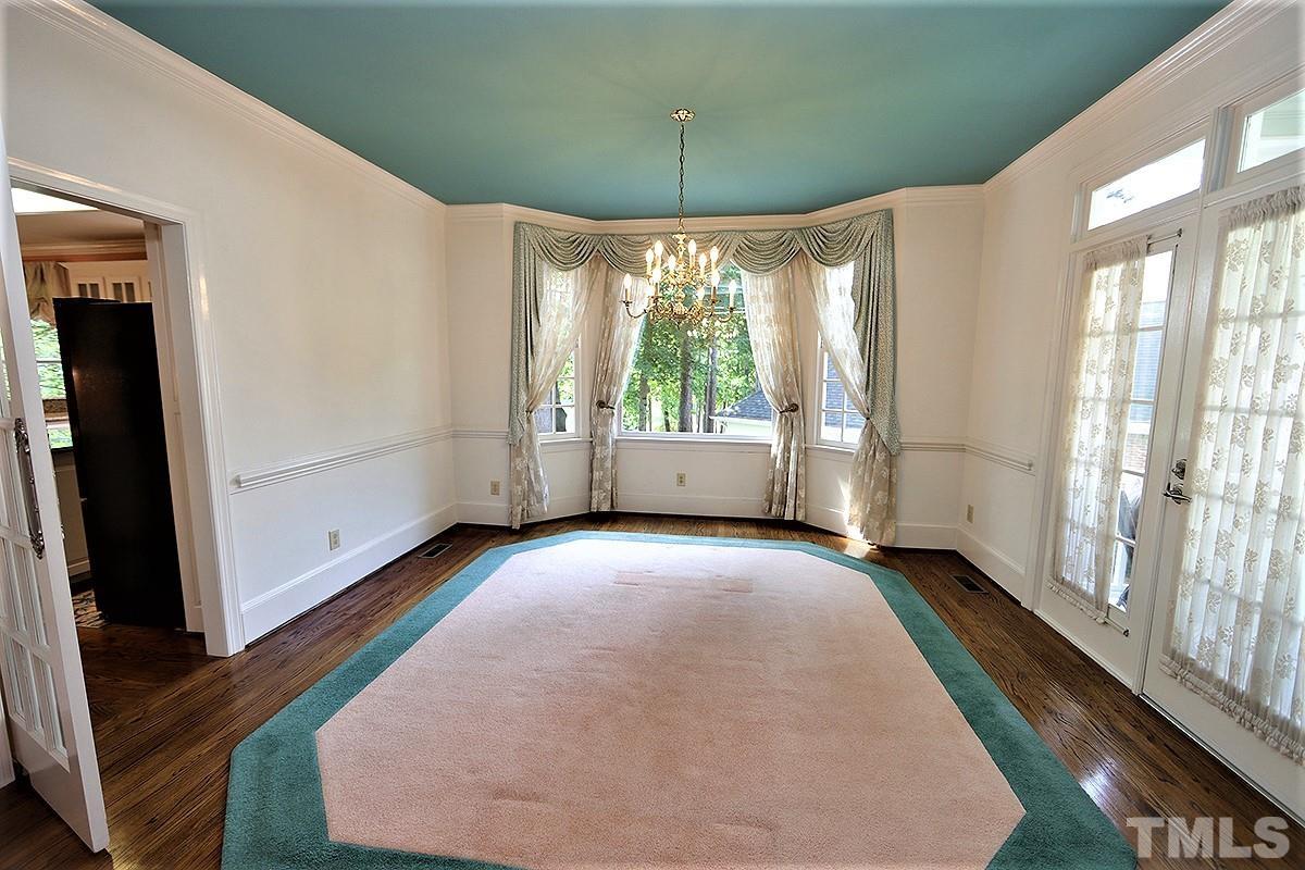 7600 Pinewild Court Raleigh, NC 27615 - Photo 11 of 52 a view of an empty room with a window